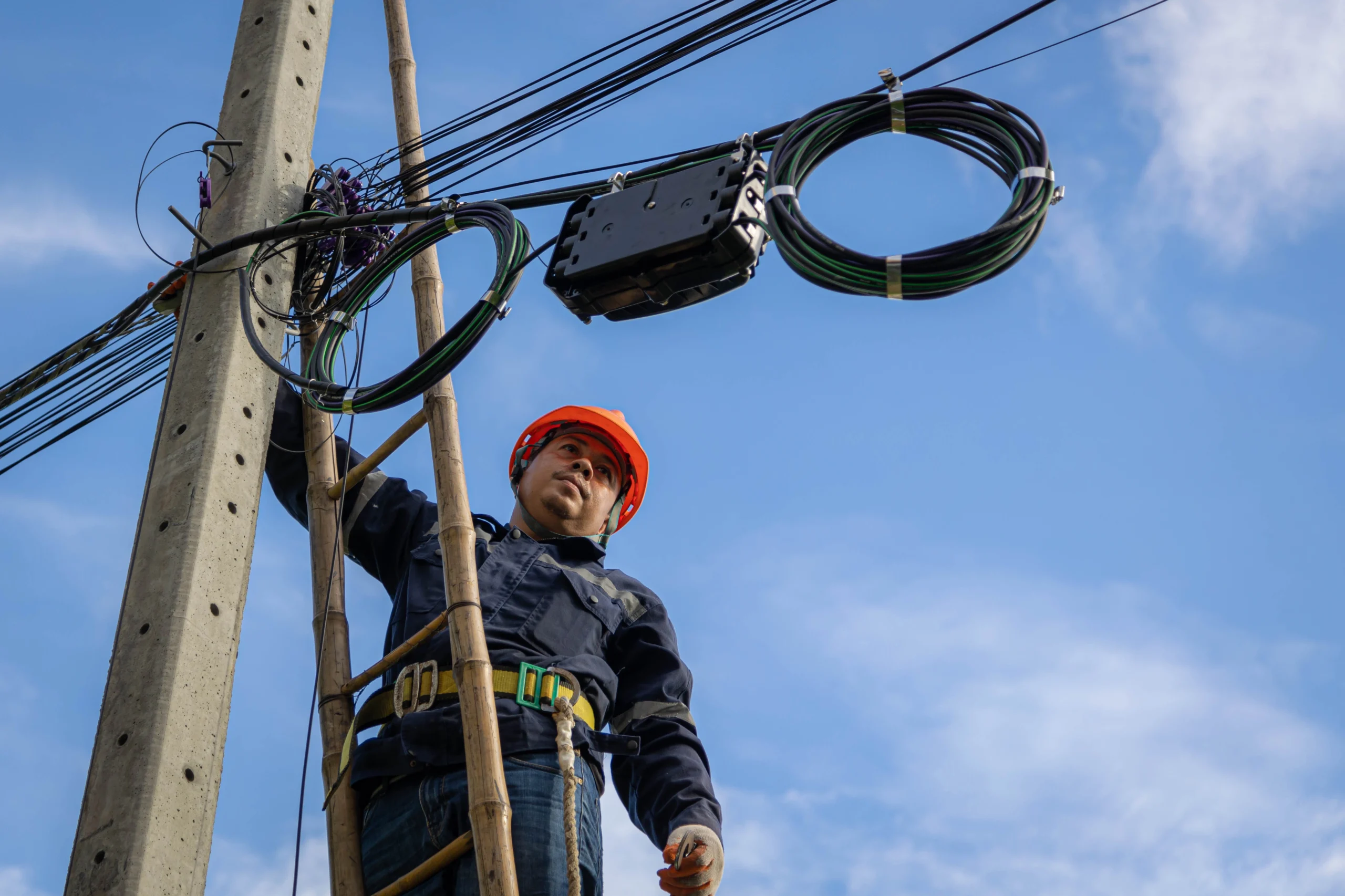 Technician are checking fiber optic cable for maintenance